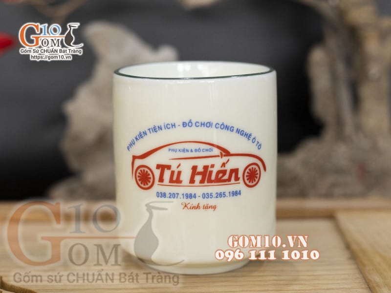 Cốc sứ men kem vẽ Sen xanh in logo