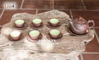 Bộ ấm chén men gốm dáng Trường Thọ, đắp đào
